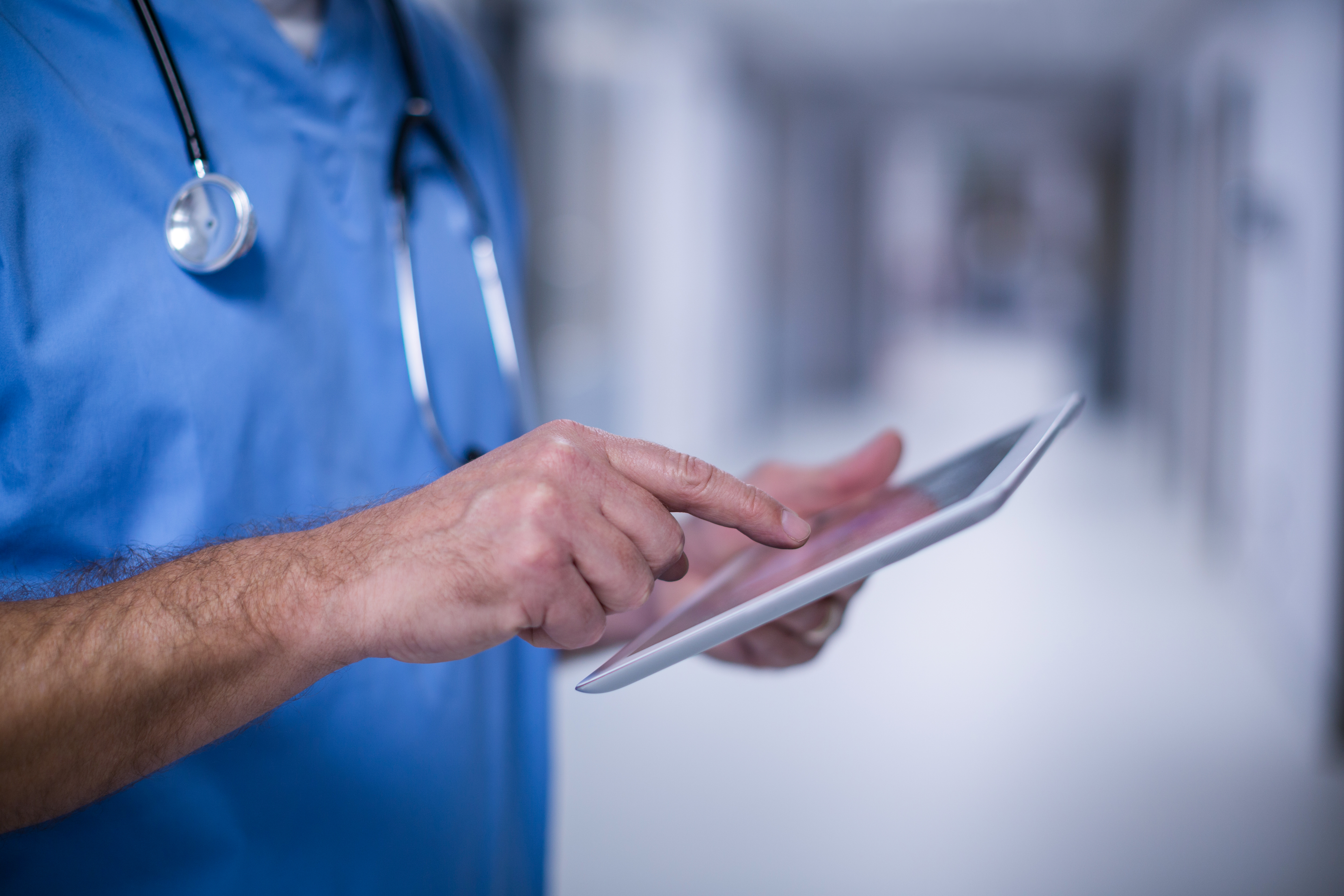 hospital worker / NHS staff member using an ipad