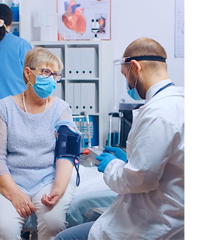 Doctor taking patient blood pressure